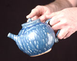 Photo of teapot being properly poured
